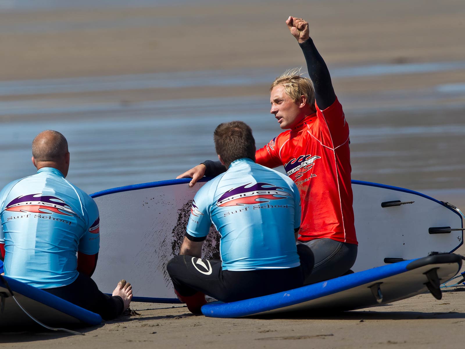 surf instructor showing safety signals