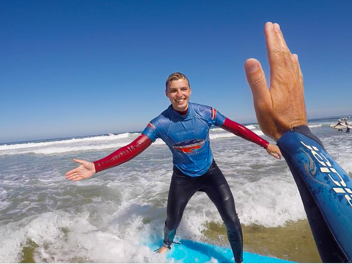 Picture of a beginner surfer having fun